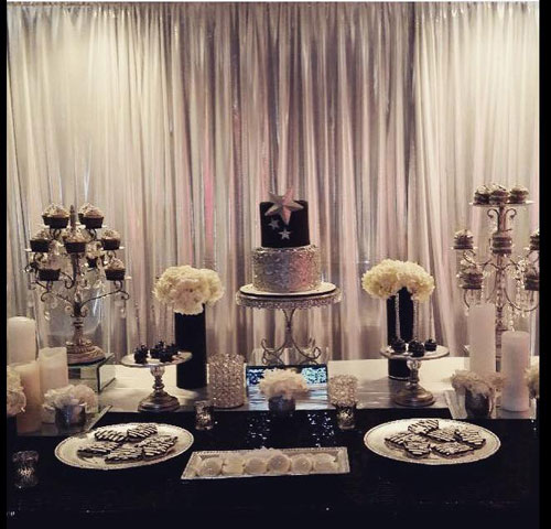 dessert table with cake and cupcake