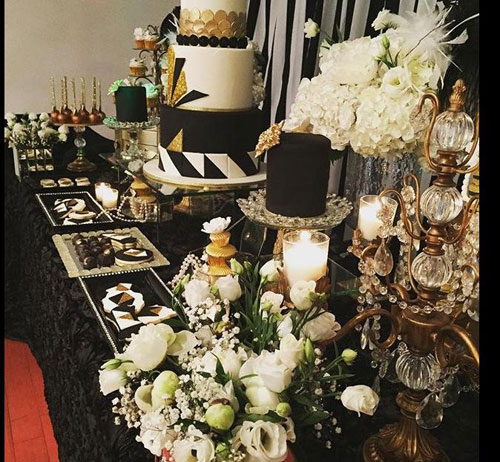 dessert table with cake and cupcake