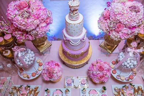 dessert table with cake and cupcake