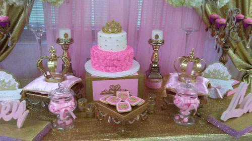 dessert table with cake and cupcake