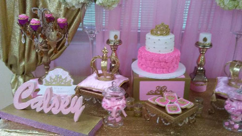 dessert table with cake and cupcake