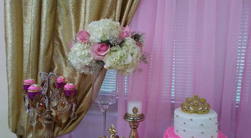 dessert table with cake and cupcake