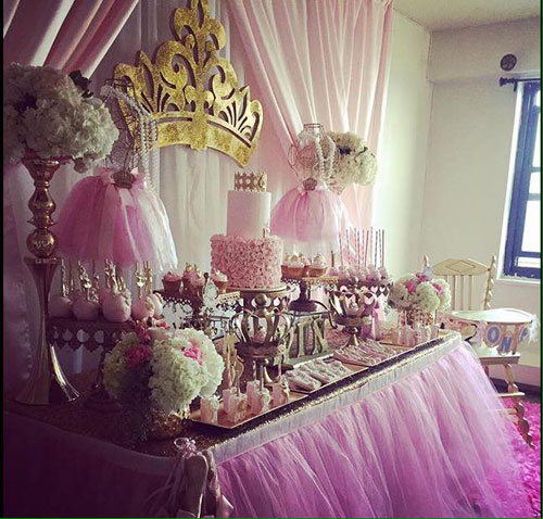 dessert table with cake and cupcake