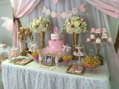 dessert table with cake and cupcake