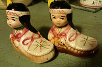 Indian couple in mocassins, salt and pepper shakers,