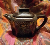 Small brown, hand-painted Japanese teapot. 