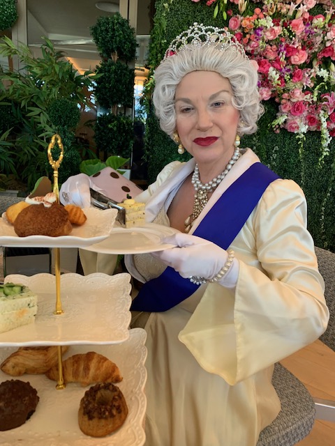 Queen Elizabeth 2 with pastries