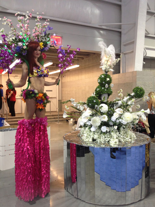 Mirror Floral Table with Sexy Stilt Walker 