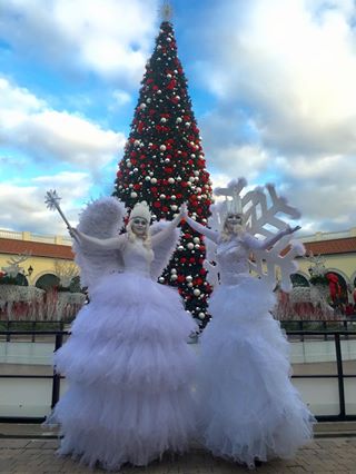 Snowflakes and Snow Queen on Stilts