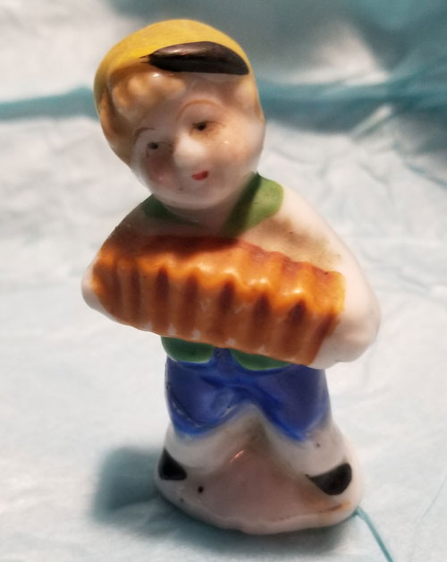 Cute little accordion boy figurine. Occupied Japan. 