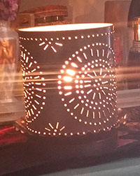 Handmade punched tin lamp.